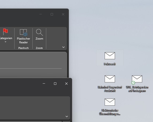 Ein Screenshot zeigt abgespeicherte Outlook-Elemente auf dem Desktop.